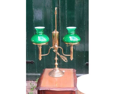 A brass country house twin oil lamp with green shades, later converted to electricity will require rewiring&nbsp;