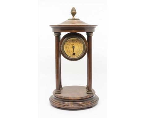 Mantel clock supporting single train French movement between 4 wooden pillars 2 ½” paper dial.&nbsp;