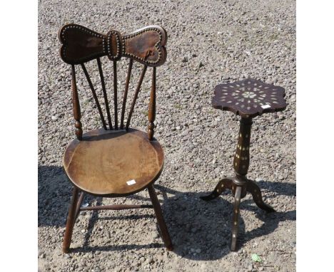 A late 19th century small tripod table inlaid with mother of pearl, shaped circular top, facetted column and three downswept 