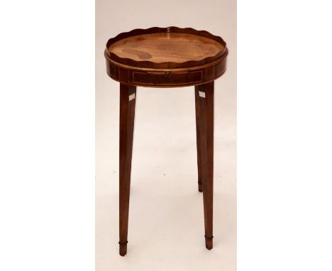 A Thomas Sheraton period George III mahogany and satinwood strung candle/lamp table, circa 1780, oval top with a serpentine f