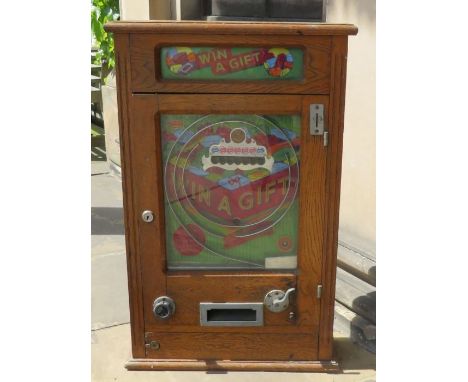 A c. 1930's "Win a Gift" fairground amusement park pinball machine by R&W, London. in original glued cabinet. front door open