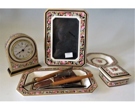 Wedgwood bone china clio dressing table set to include quartz clock and a manicure setThese lots have been donated by Rotary 