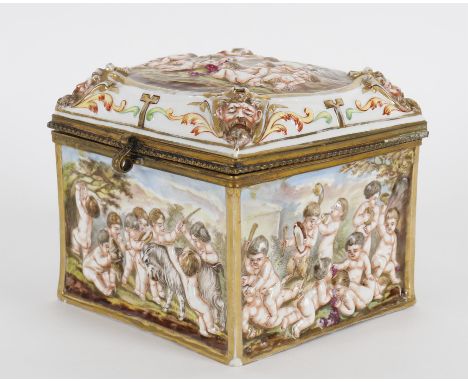 
	
		A late 19th/early 20th century Capodimonte porcelain casket, decorated with putti at play and with gilt metal mounts, 15