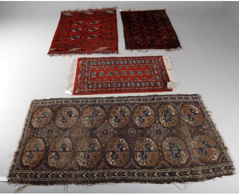 
	
		Four Turkoman pattern rugs including antique rug- possible Ersari,  with design of seven guls in two rows, 163 by 91cms,