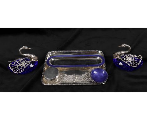 
	
		A pair of silver mounted blue glass sweet dishes of swan form, with hinged swivel wings, import marked 1961, 13cms high;