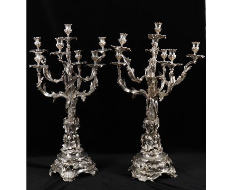 
	
		A pair of silver plated seven light candelabra in the 19th century manner, mid/late 20th century stamped Whitby Plate, L