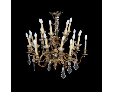 
	
		A Continental gilt-bronze and cut glass twenty-four light chandelier in Rococo taste, late 19th century and adapted, of 