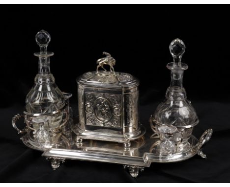 
	
		An early 20th century silver plated decanter and biscuit box stand, box with stag finial and a pair of ring necked sherr