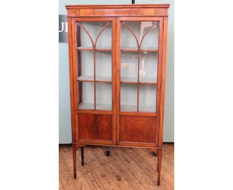 An Edwardian mahogany two door display cabinet with two shelf interior, width 35" x depth 13", height 66"