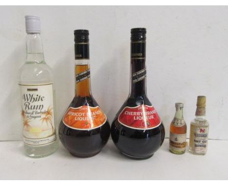 One bottle Cusenier Apricot Brandy Liqueur, one bottle Cusenier Cherry Brandy Liqueur, one bottle White Rum, two miniatures C