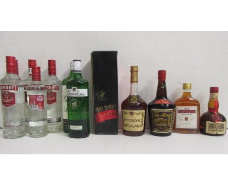 Five bottles and one half bottle Smirnoff Vodka, 1 litre, 1 bottle Gordons Gin, one bottle Hennessy Cognac V.S., one half bot