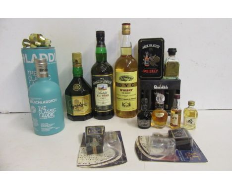 One bottle Bruichladdich "Classic Laddie" Islay single malt, boxed, one bottle Signature Mcdowell, one bottle 1992 Famous Gro