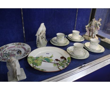 An assortment of ceramics and porcelain to include a Royal Copenhagen model of parrots, a part tea service, figure group etc 