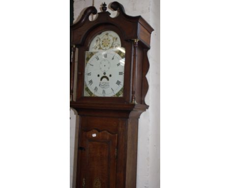 A 19th Century oak and inlaid longcase clock, with a painted dial and subsidiary dial, Ja F. Skipton, Cirencester 220cm high,