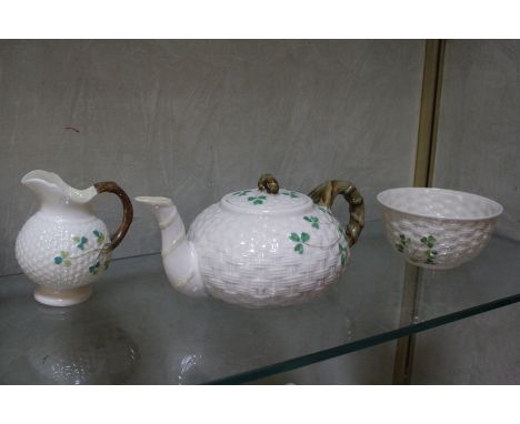 A Belleek shamrock tea service, second period, to include teapot, jug, sugar basin, two cups, two saucers and two plates 