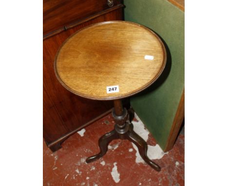 A slender Georgian style mahogany tripod table; and a Vono green baise covered card table.
