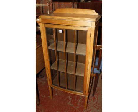 A mid 20th century light oak display cabinet. Best Bid