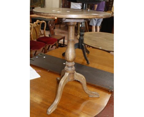 A small 19th century oak tripod table and black lacquered Japanned tripod table.