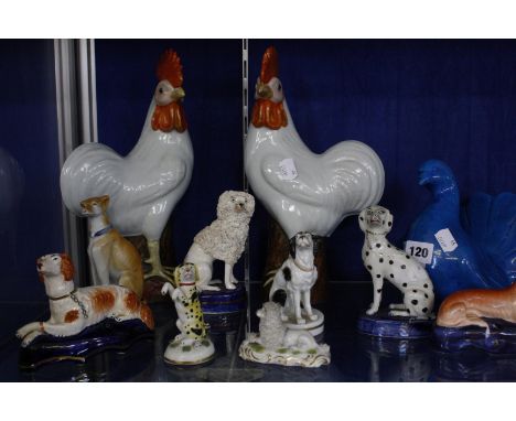 A selection of porcelain and pottery model dogs, a 19th Century Staffordshire model dog, a pair of poodles, sporting dogs pen