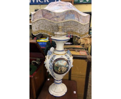 POTTERY BALUSTER TABLE LAMP ENCRUSTED WITH FLOWERS WITH FRINGED FLORAL SHADE