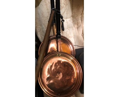 TWO ANTIQUE COPPER WARMING PANS AND A FLAIL STICK 