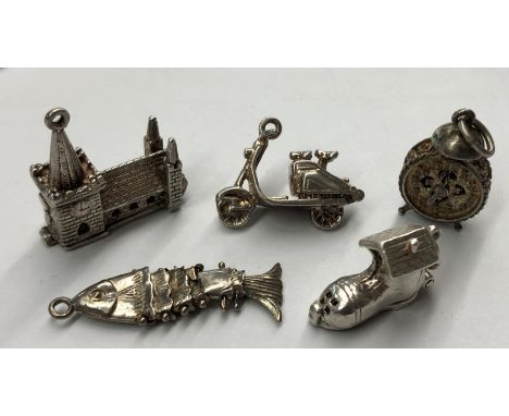 BAG OF FIVE SILVER BRACELET CHARMS, A CHURCH, MOPED, ALARM CLOCK AND ARTICULATED FISH