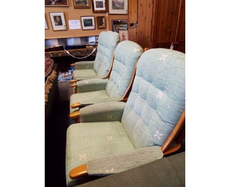 A beech framed two-seater settee cottage suite with green button back upholstery