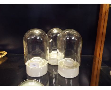 Three dome topped glass and ceramic industrial light fittings