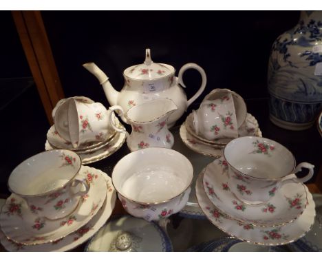 A Richmond china six place tea service in 'Rose Time' pattern, comprising teapot, sugar bowl, milk jug, cups, saucers and sid