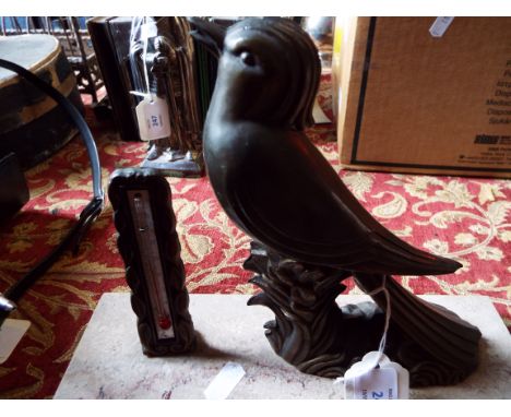 An Art Deco bronzed bird resting on a marble plinth with thermometer 