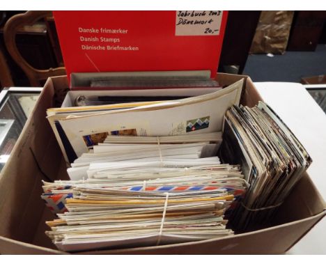 A box of assorted Swiss first day covers and stamps