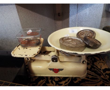 A set of vintage kitchen scales and weights