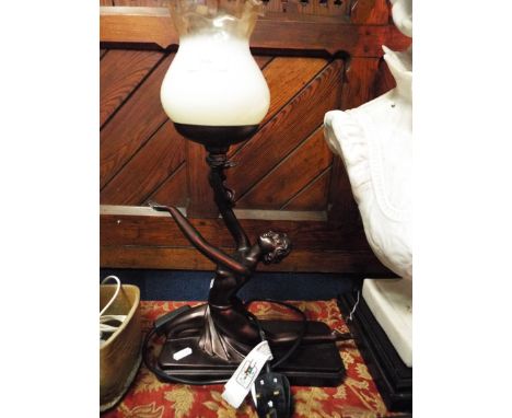 A reproduction lamp with Art Deco dancer base and glass lamp
