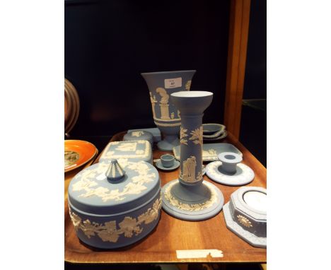 A selection of assorted Wedgwood Jasper ware, items to include candlestick, lidded trinket pots, urn shaped vase, miniature t