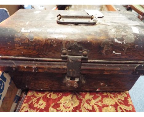 A vintage tin trunk with painted decoration to make it appear wooden