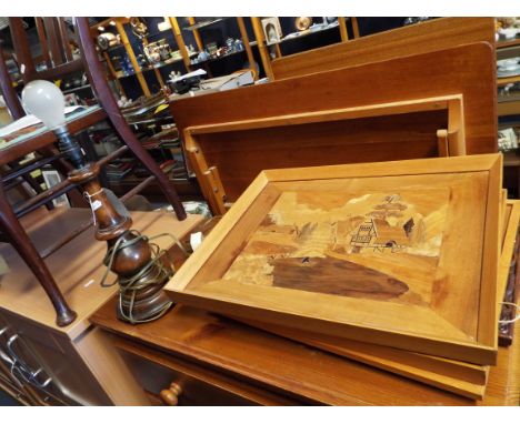 A turned wooden lamp and gingerbread carved plaque and four parquetry pictures 
