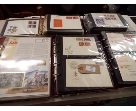 Four albums of Swiss first day covers and a Polish album of first day covers
