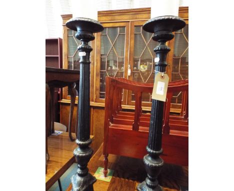 Two cast iron pricket candle stick in the form of columns 