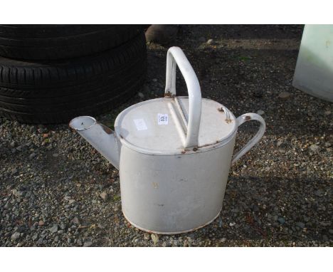 An enamel watering can.