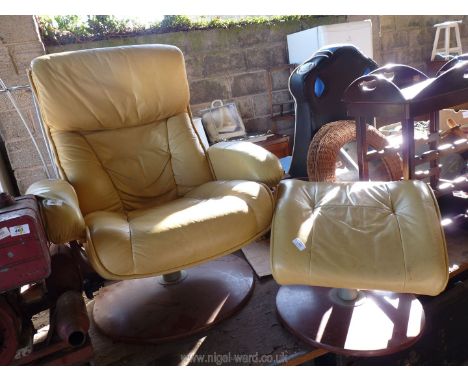 A vintage mustard yellow swivel chair and matching foot rest (some damage).