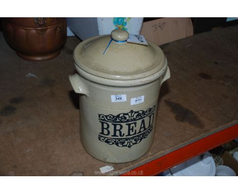 A large bread crock with lid, 14 1/2" tall.