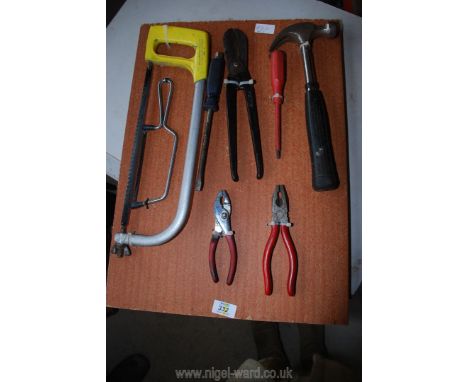 Tin snips, two pairs of pliers, claw hammer, etc.