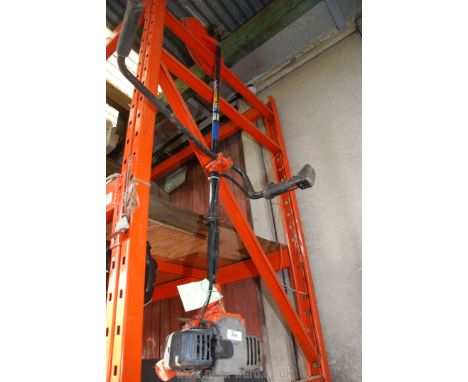A Tarka strimmer for spares or repair, (engine will not turn, sold as seen).