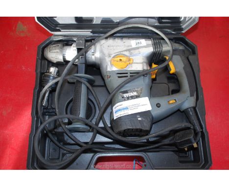 A boxed Titan Magnesium power drill with chuck (running at time of cataloguing)