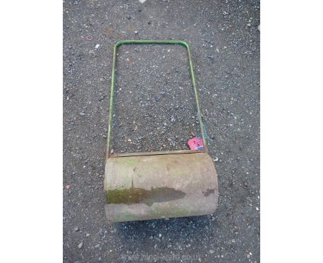 A metal water filled garden roller.