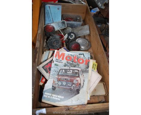 A wooden drawer of vintage car lamps, bulbs and motoring magazines.