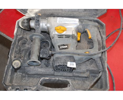 A cased hammer Drill with one drill bit and chuck (running at time of lotting)