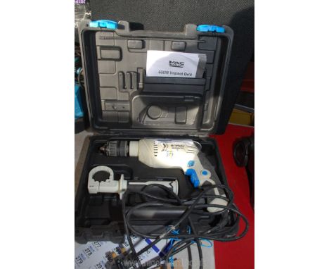 A 240 volt electric drill with case (running at time of lotting)