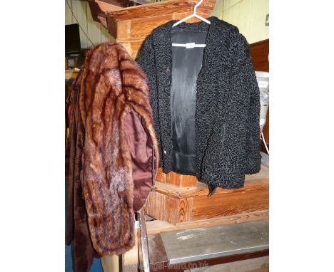 A black vintage lambs wool effect 3/4 coat and a fur stole.