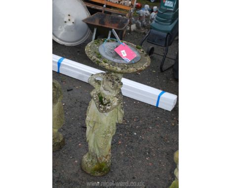 A concrete statue of a woman supporting sundial top, 3 feet high.